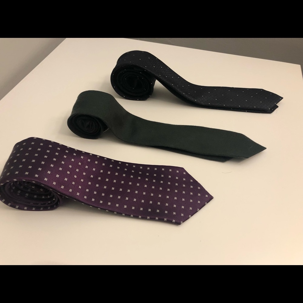 Three skinny ties, purple, green, and blue